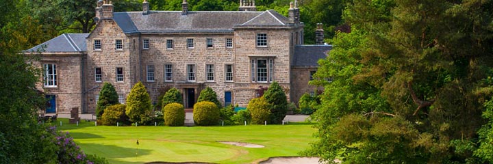The 18th green of the championship course at Cawder Golf Club and the 18th century clubhouse