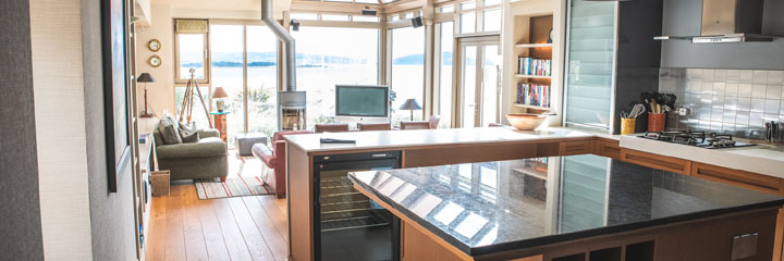 The well equipped kitchen and lounge area of the Golf Lodge accommodation, between the 14th and 15th fairways of Castle Stuart Golf Links, and available exclusively to golfers playing Castle Stuart.