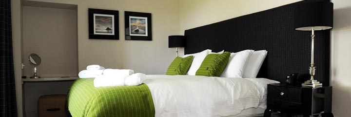 One of the well presented bedrooms at the Farmhouse accommodation at Castle Stuart Golf Links, available exclusively to golfers - the Farmhouse can sleep up to 8 people with bedrooms able to be set up