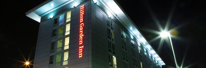 The exterior of the Hilton Garden Inn Glasgow City Centre at night