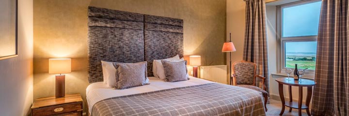 A contemporary styled double bedroom at the 4 star Royal Golf Hotel in Dornoch, overlooking the Royal Dornoch Golf Club Championship course.