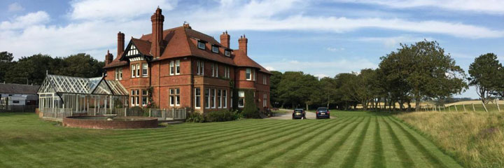 An exterior view of Sandhill House in Troon