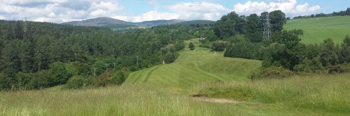 The 12th hole on Alness golf course in the north of Scotland, with the hills in the background