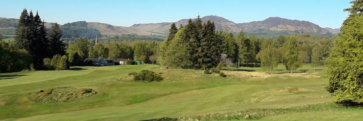 A view across Comrie golf course with the hills behind 