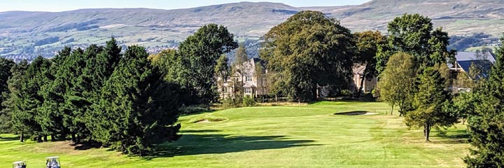 A view of the Carrickstone course at Dullatur Golf Club, showing the mature trees lining fairways on the course