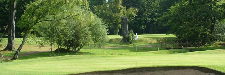 A view of one of the greens at Gogarburn Golf Club showing the mature trees which are all around the course