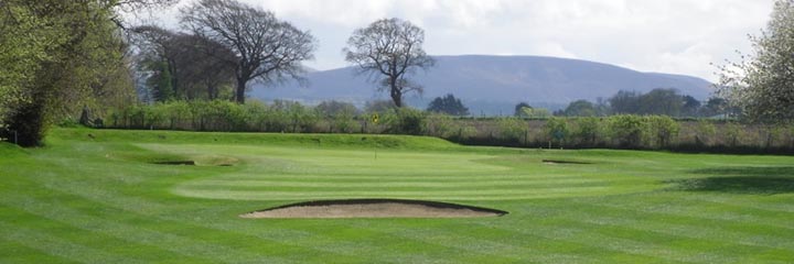 A view across one of the greens Gogarburn Golf Club towards the Pentland Hills
