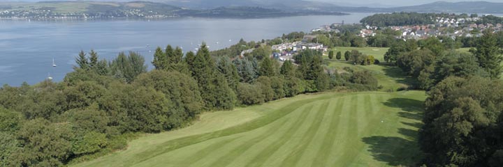 An aerial view down one of the tree lined fairways of Gourock Golf Club to the town of Gourock with the Clyde estuary on the left