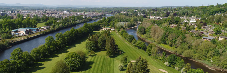 An aerial view of King James VI Golf Club showing the river that surrounds the course