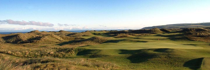 A view of the Machrihanish Golf Club championship course, showing the classic undulating links terrain