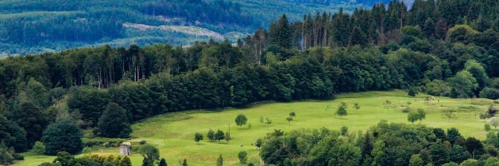 A view over the parkland golf course at Newton Stewart Golf Club towards the Galloway Hills
