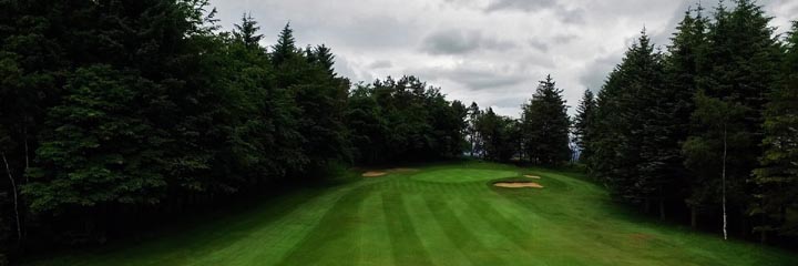 Looking up the fairway towards the 16th green at Ranfurly Castle Golf Club in the west of Scotland