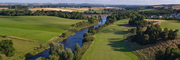 The long 14th hole is the course signature hole with the River Tweed to the left and the viaduct in the distance beyond the green.