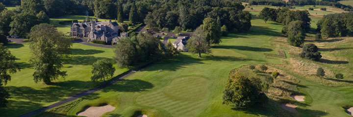 An aerial shot of both the tree-lined Roxburghe golf course and the Schloss Roxburghe Hotel to the left