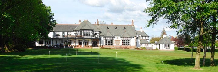 The clubhouse and putting green at Royal Burgess Golf Club